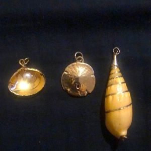 3 pendants layered in small amounts of gold